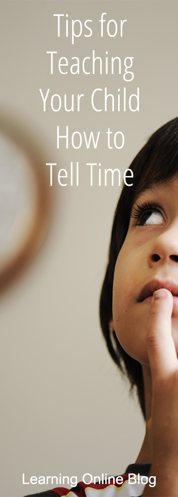 Boy looking at clock - Tips for Teaching Your Child How to Tell Time