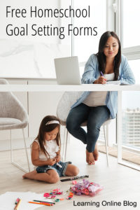 Mom writing at desk and child playing - 