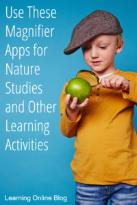 Boy looking through magnifying glass at apple - Use These Magnifier Apps for Nature Studies and Other Learning Activities