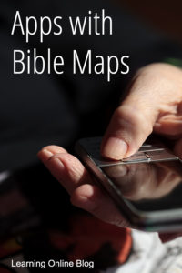Hand holding cell phone - Apps with Bible Maps