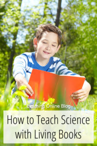 Boy reading outside - How to Teach Science with Living Books