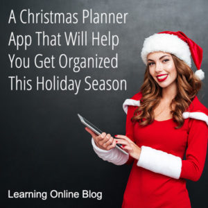 Woman with Santa hat holding a tablet - A Christmas Planner App That Will Help You Get Organized This Holiday Season