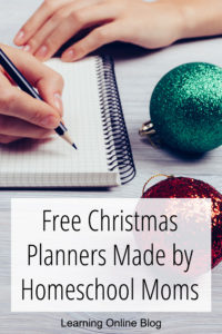 Woman writing on notepad - Free Christmas Planners Made by Homeschool Moms
