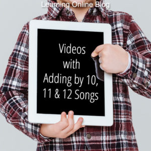 Boy holding tablet - Videos with Adding by 10, 11 and 12 Songs