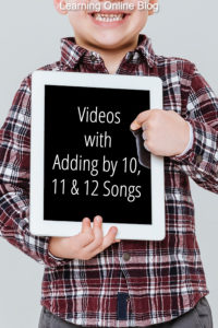 Boy holding tablet - Videos with Adding by 10, 11 and 12 Songs