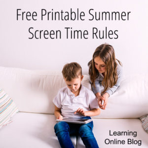 Two children looking at a tablet - Free Printable Summer Screen Time Rules