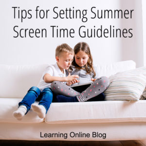 Two children looking at a tablet - Tips for Setting Summer Screen Time Guidelines