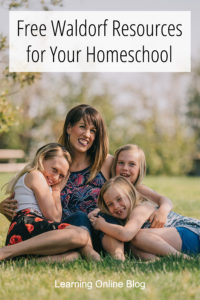 Mom and children sitting on the grass - Free Waldorf Resources for Your Homeschool