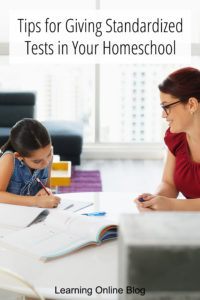Mom giving a child a test - Tips for Giving Standardized Tests in Your Homeschool