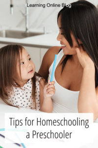 Mom sitting with child - Tips for Homeschooling a Preschooler