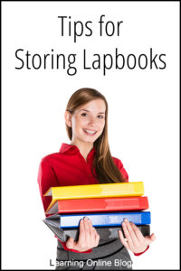 Woman holding binders -Tips for Storing Lapbooks